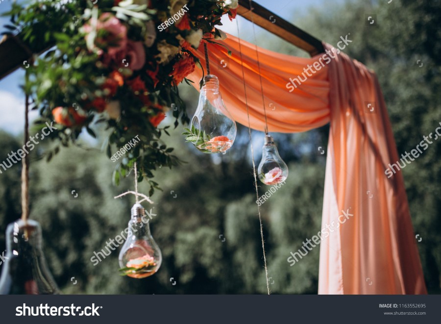 stock-photo-beautiful-wedding-decor-with-flowers-and-wood-1163552695.jpg